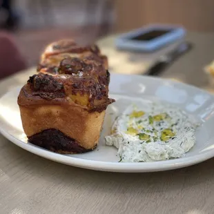 Caramelized onion bread. Asiago and havarti inside. Herb labneh (yogurt and mint?) on side.