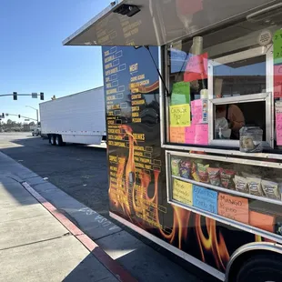 a food truck parked on the side of the road
