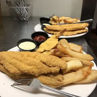 Two filets with fries