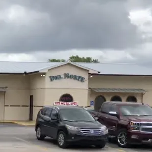 cars parked in front of the restaurant