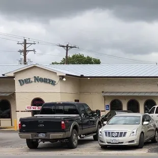 cars parked in front of the restaurant