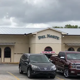 cars parked in front of the restaurant