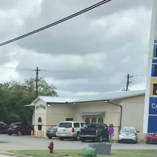a gas station with a gas station sign