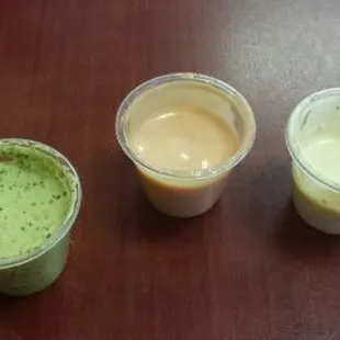 3 sauces, a cilantro spicy and white cream, are ok, the pink one is NOT aji, taste it before putting it on you food...