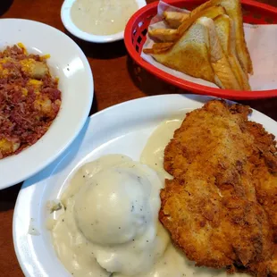 Delicious chicken fried chicken dinner with loaded tots, Texas toast and mashed potatoes and gravy!