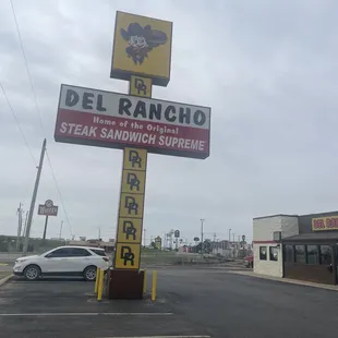 a sign for a del rancho steak sandwich supreme