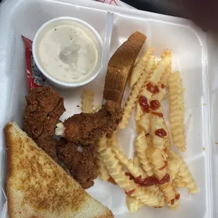 Chicken strips, fries and gravy with Texas toast