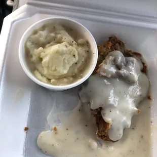 a meal in a styrofoam container