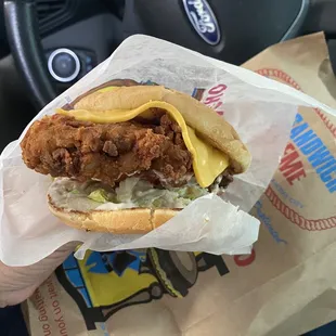 a fried chicken sandwich in a wrapper