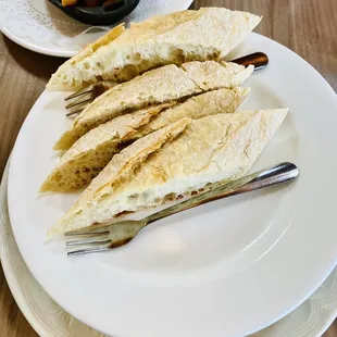 Natural Burgundy Snails in Garlic presented with bread on top