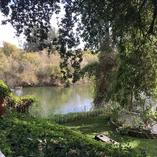 View of the river and part of the reception area from the bridal cottage. Wedding 10/21/23