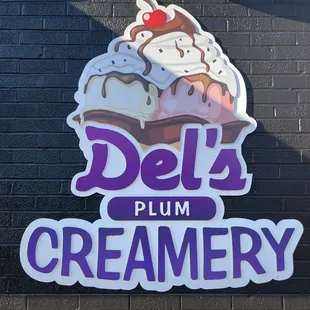 a sign for del's plum creamery