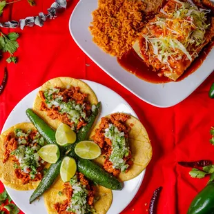 mexican food on a red table cloth