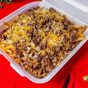 a container of chili cheese nachos