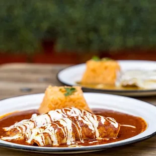 two plates of enchiladas