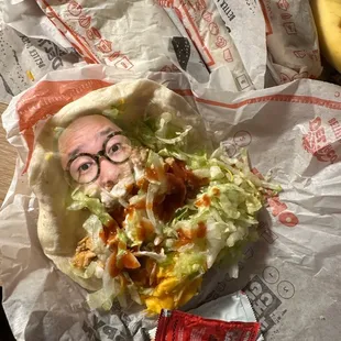a man&apos;s face in a burrito