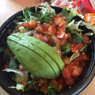 Avocado veggie bowl ! Good new healthier Choice . Rice, black beans, avocado, tomatoes, onions, lettuce