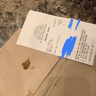 a piece of paper taped to a piece of cardboard