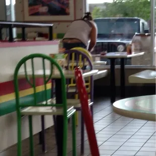 a person sitting at a table in a restaurant