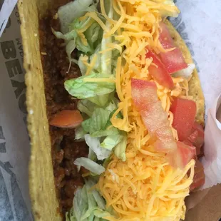 Beyond Meat (soy protein) taco. $2.68 with tax. Tastes like a regular taco but not vegan because there's regular dairy cheese
