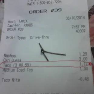 Metal piece found in my taco at Del Taco with receipt to help show size.