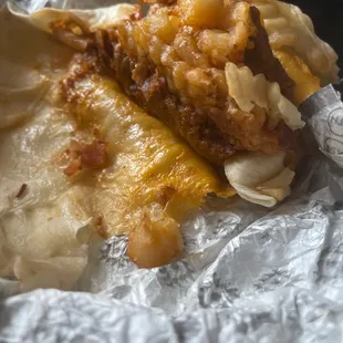a burrito with meat and cheese