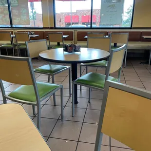 Table not wiped and food on floor.