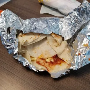 Breakfast toasted wrap. Got it to go. Thanks for halfway wrapping it. Doesn't look anything like their ad