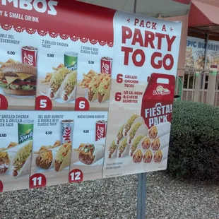 a party to go sign in front of a restaurant