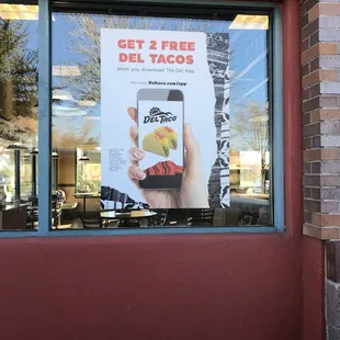 a sign in the window of a restaurant