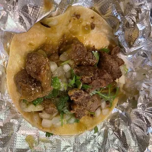 a taco with meat and vegetables