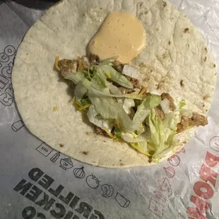 Empty chicken taco I dumped some sauce in