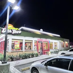 a car parked in front of a restaurant