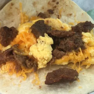 Interior of steak breakfast taco, eggs needed hot sauce but taco was better than I was expecting! Steak was tender and flavorful