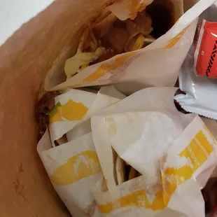 Look at they way they handle the food. Not wrapped, exposed, beans and meat falling through the bag... awful.