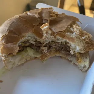 Double Del Cheeseburger with old dry bread and hardly any cheese.