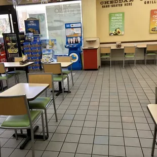 empty tables and chairs in a restaurant