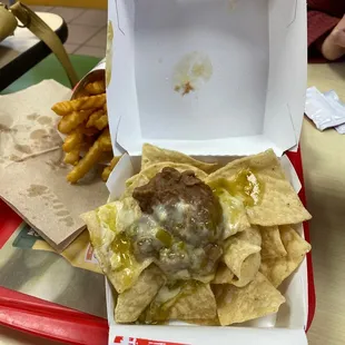 a person holding a box of food