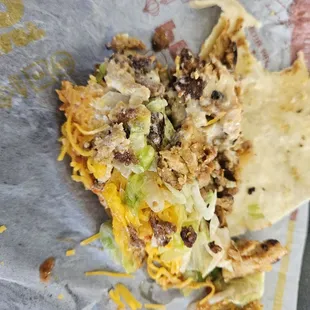 A dry chicken burnt taco.