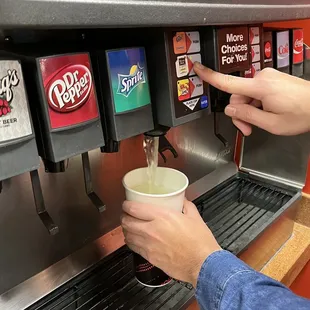 a person using a coffee machine