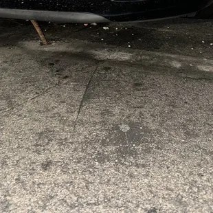 Two metal spikes at parking spot.