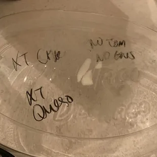 a clear bowl with writing on it