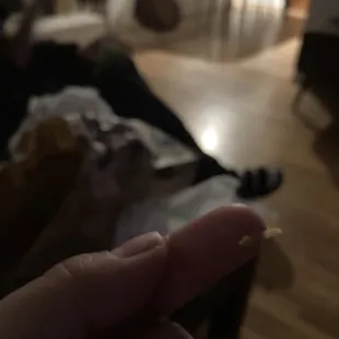 a person holding a piece of food in their hand