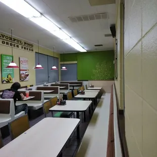 empty tables and chairs in a cafeteria