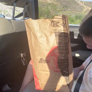 Either side of bag that everything comes in