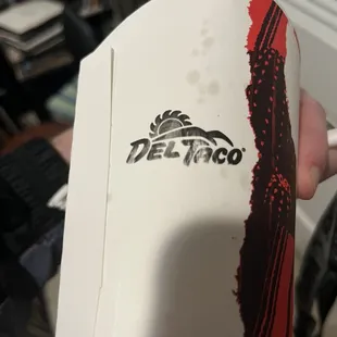 a person holding a surfboard in their hand