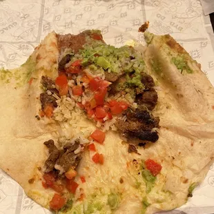 a tortilla with meat and vegetables