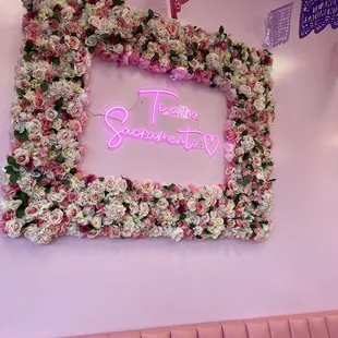 a pink frame with flowers