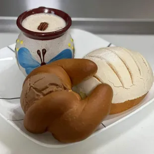 a cup of coffee and a loaf of bread