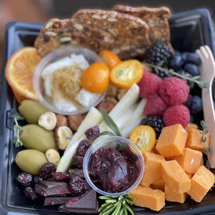 a platter of fruit and cheese
